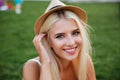 Close up portrait of a smiling young woman in hat Royalty Free Stock Photo