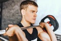 Close-up portrait of sporty muscular fitness man preparing to deadlift a barbell over his head in modern fitness club. Functional Royalty Free Stock Photo