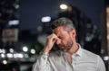 Close up portrait of stressed business man on night city background. Stressed ceo manager have stress and headache Royalty Free Stock Photo