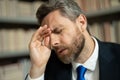 Close up portrait of stressed man with headache migraine. Tired businessman is working overtime and has headache. Man Royalty Free Stock Photo