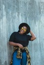 Close-up portrait of stylish young African American girl with curly hair in fashionable sunglasses in urban - summer Royalty Free Stock Photo