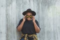 Close-up portrait of stylish young African American girl with curly hair in fashionable sunglasses in urban - summer Royalty Free Stock Photo