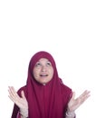 Close-up portrait of surprised beautiful muslim girl and open-mouthed. Over white background.