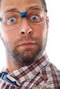 Close up portrait of surprised elegant geek in glasses