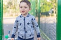 Close up portrait of a surprised european baby boy looking at camera over light background Royalty Free Stock Photo