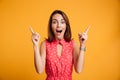 Close-up portrait of surprised pretty young woman in red dress p Royalty Free Stock Photo