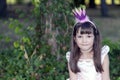 Close up portrait of a sweet little girl with a crown on her head