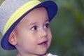 Close up portrait of a sweet little smiling baby boy with a hat Royalty Free Stock Photo