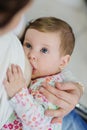 Close-up portrait of sweet newborn baby breastfeeding Royalty Free Stock Photo