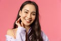 Close-up portrait of tender, beautiful young asian woman with clean skin, no pimples or blemishes, smiling lovely camera Royalty Free Stock Photo