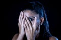 Close up portrait terrified young attractive latin woman looking frightened through her fingers in facial expressions and human