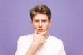 Close up portrait of a thoughtful young man wearing a white T-sh Royalty Free Stock Photo