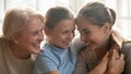 Close up portrait three different generations beautiful women