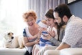 Close up portrait of three generations of women being close, grandmother, mother and baby daughter at home Royalty Free Stock Photo