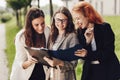 Close up portrait of three successful caucasian businesswomen in suits standing on the street Royalty Free Stock Photo