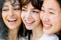 Close-up portrait of three young girls joining faces for portrait. Royalty Free Stock Photo