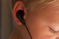 Close up portrait of toddler boy with ear-phones Royalty Free Stock Photo
