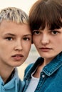 Close up portrait of two attractive young women with short hair looking at camera, Young lesbian couple spending time Royalty Free Stock Photo