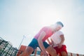 Close up portrait of two basketball players while the push each other for ball possession Royalty Free Stock Photo