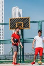 Close up portrait of two basketball players while the push each other for ball possession Royalty Free Stock Photo