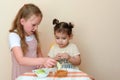 Jewish children dipping apple slices into honey on Rosh HaShanah. Royalty Free Stock Photo