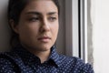 Close up portrait of unhappy melancholic young Indian woman