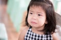 Close Up portrait of upset Asian adorable little girl. Cute child is crying pout her mouth, tears flow on her cheeks. Royalty Free Stock Photo