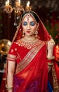 Close up Portrait of very beautiful indian Bride in bridal costume with makeup and stone jewellery Royalty Free Stock Photo