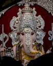 Close up portrait view of decorated and garlanded idol of Hindu God Ganesha in ulshibaugPune ,Maharashtra, India.