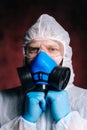 Close-up portrait of virologist medical worker wearing protective suit. Royalty Free Stock Photo