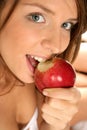 Close-up portrait of woman with apple