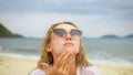 Close-up portrait woman apply sun cream protection lotion. Young woman on beach near sea applying sunscreen. Pretty Royalty Free Stock Photo