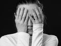 Close up portrait of a woman closing her face by the palms Royalty Free Stock Photo