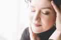 close-up portrait of a woman with dark curly hair. A woman with a dreamy expression. Royalty Free Stock Photo