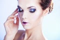 Close up portrait of woman with smoky eyes over Royalty Free Stock Photo