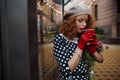 Close up portrait woman in vintage dress holding cup of coffee of the city background Royalty Free Stock Photo