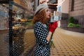 Close up portrait woman in vintage dress holding cup of coffee of the city background Royalty Free Stock Photo