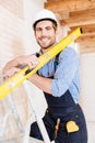 Close-up portrait of a working man with level Royalty Free Stock Photo