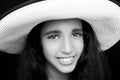 portrait of a young african american girl laughing with sun hat Royalty Free Stock Photo