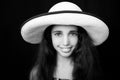 portrait of a young african american girl laughing with sun hat Royalty Free Stock Photo