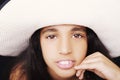 Close up portrait of a young african american girl with sun hat Royalty Free Stock Photo