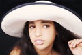 Close up portrait of a young african american girl with sun hat Royalty Free Stock Photo