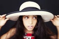 Close up portrait of a young african american girl with sun hat Royalty Free Stock Photo