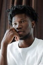 Close-up portrait of young African American man with dreadlocks. Royalty Free Stock Photo