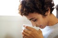 Close up young african american woman drinking tea from cup Royalty Free Stock Photo