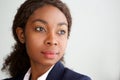 Close up young african businesswoman looking away and thinking Royalty Free Stock Photo