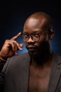 Close up portrait of young african man isolated on black studio background Royalty Free Stock Photo