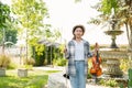 Close-up portrait of Young Asia woman music violinist play violin, relax in the garden with peace of mind Royalty Free Stock Photo