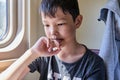 Close-up portrait of young asian thinking boy