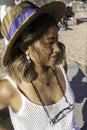 Close up portrait of a young Asian woman relaxing on the beach in Lisbon, Portugal. Beautiful woman wearing a stylish hat and Royalty Free Stock Photo